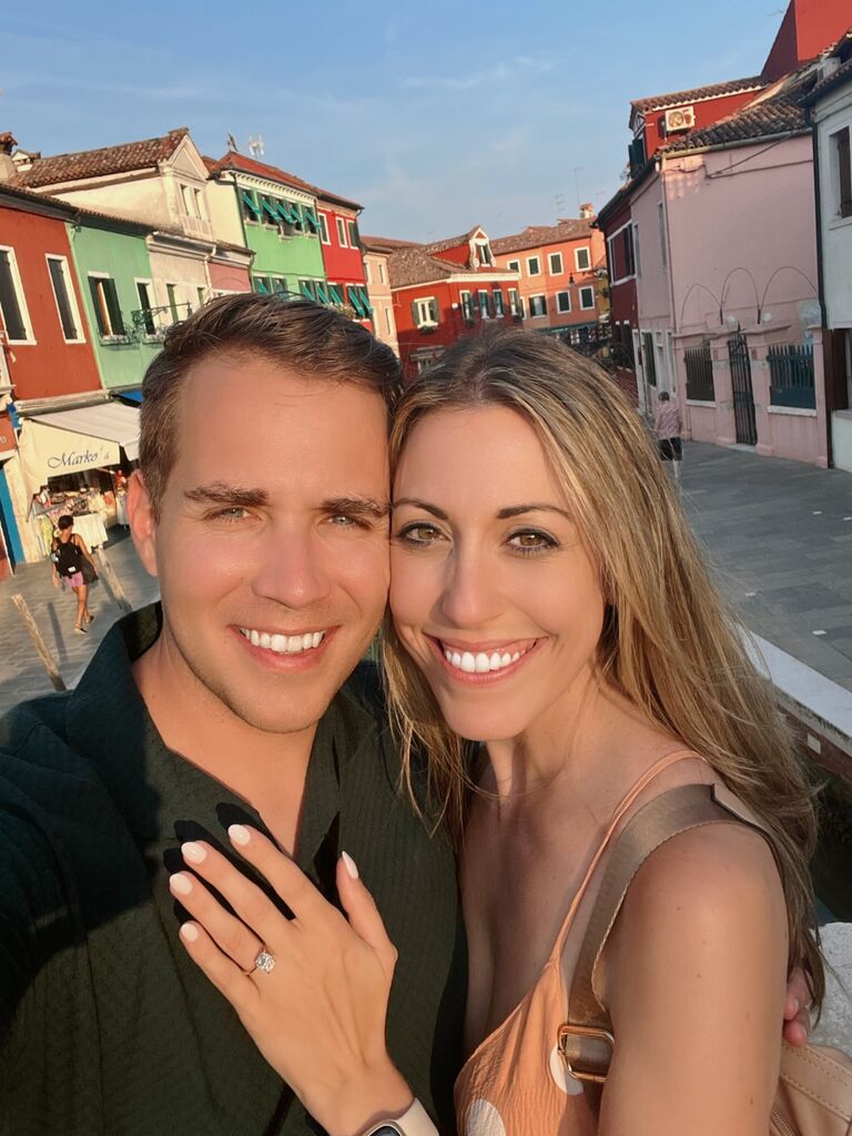 Austin proposes to Danielle in Burano, a small island in Venice, Italy. Fun Fact: Danielle blacked out during the proposal and doesn't remember taking this picture!