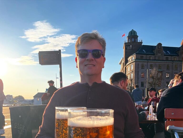 Justin enjoys a beer in Bergen, Norway.