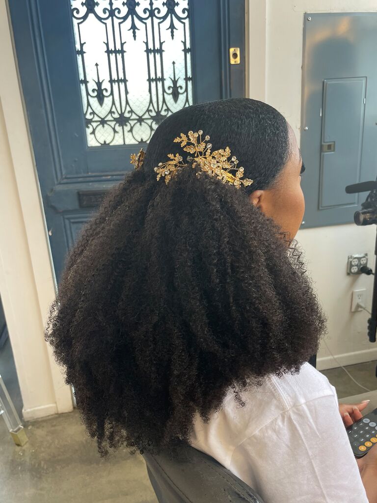 Kinky, curly Black wedding hairstyle with gold hair accessories