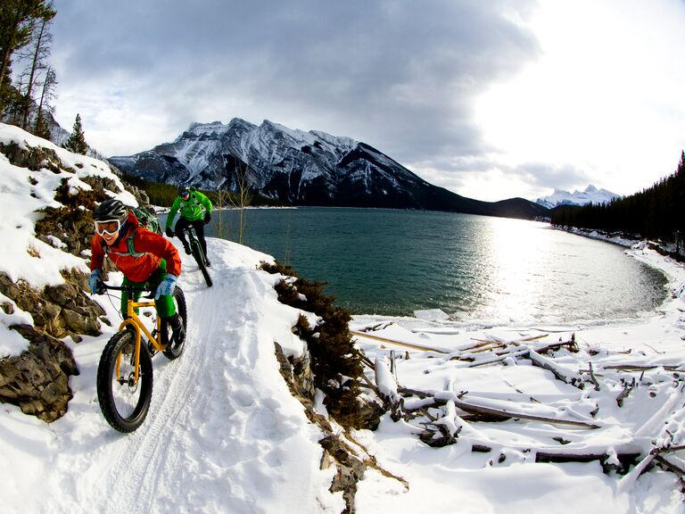 Couple enjoy bike ride in winters