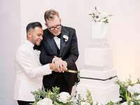 Couple cutting the cake at wedding