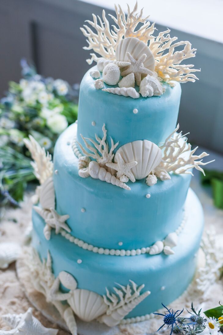 White Seashell And Coral Decorated Blue Wedding Cake