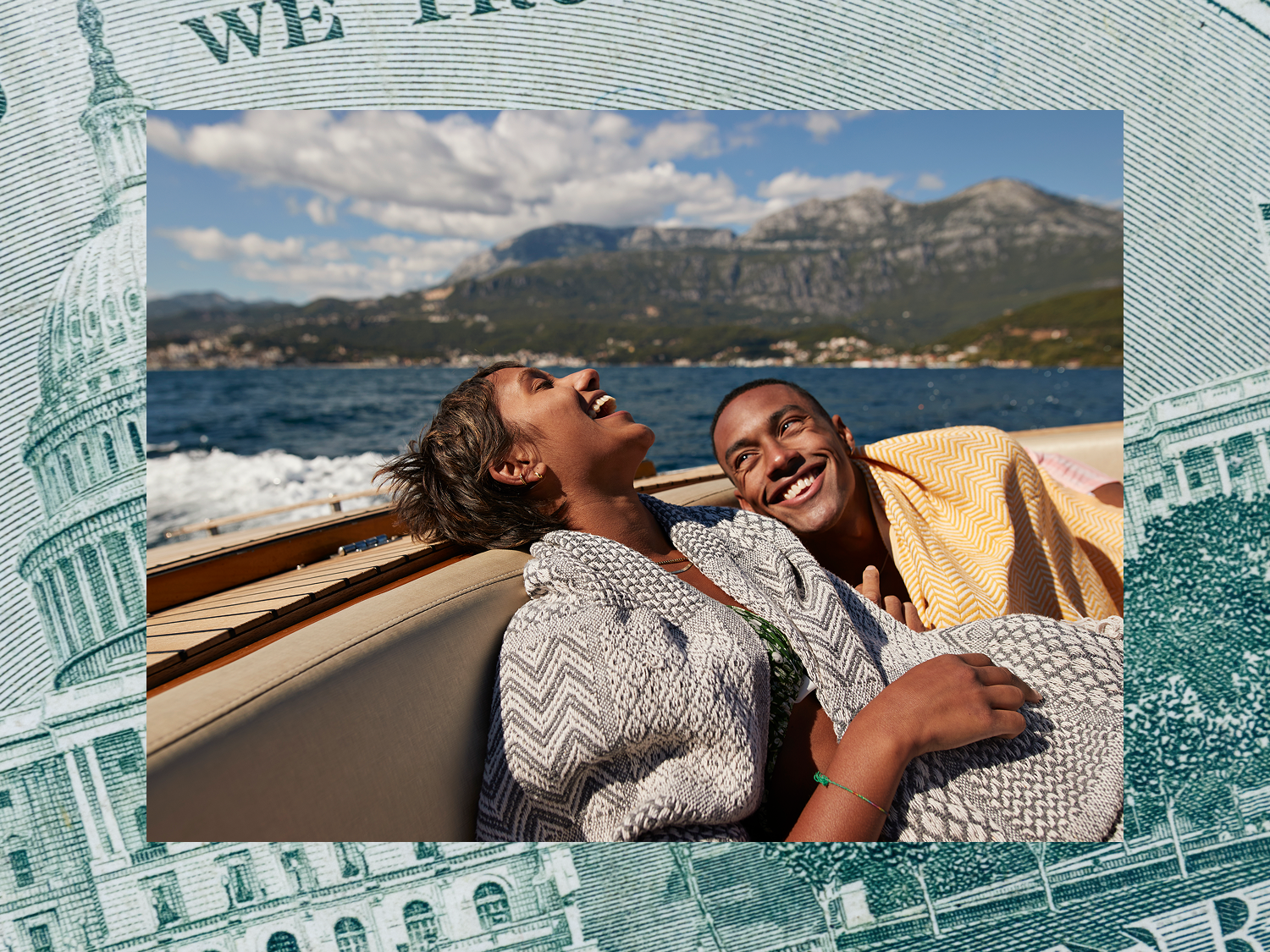 Couple laughing on a boat during their honeymoon