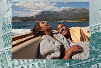 Couple laughing on a boat during their honeymoon