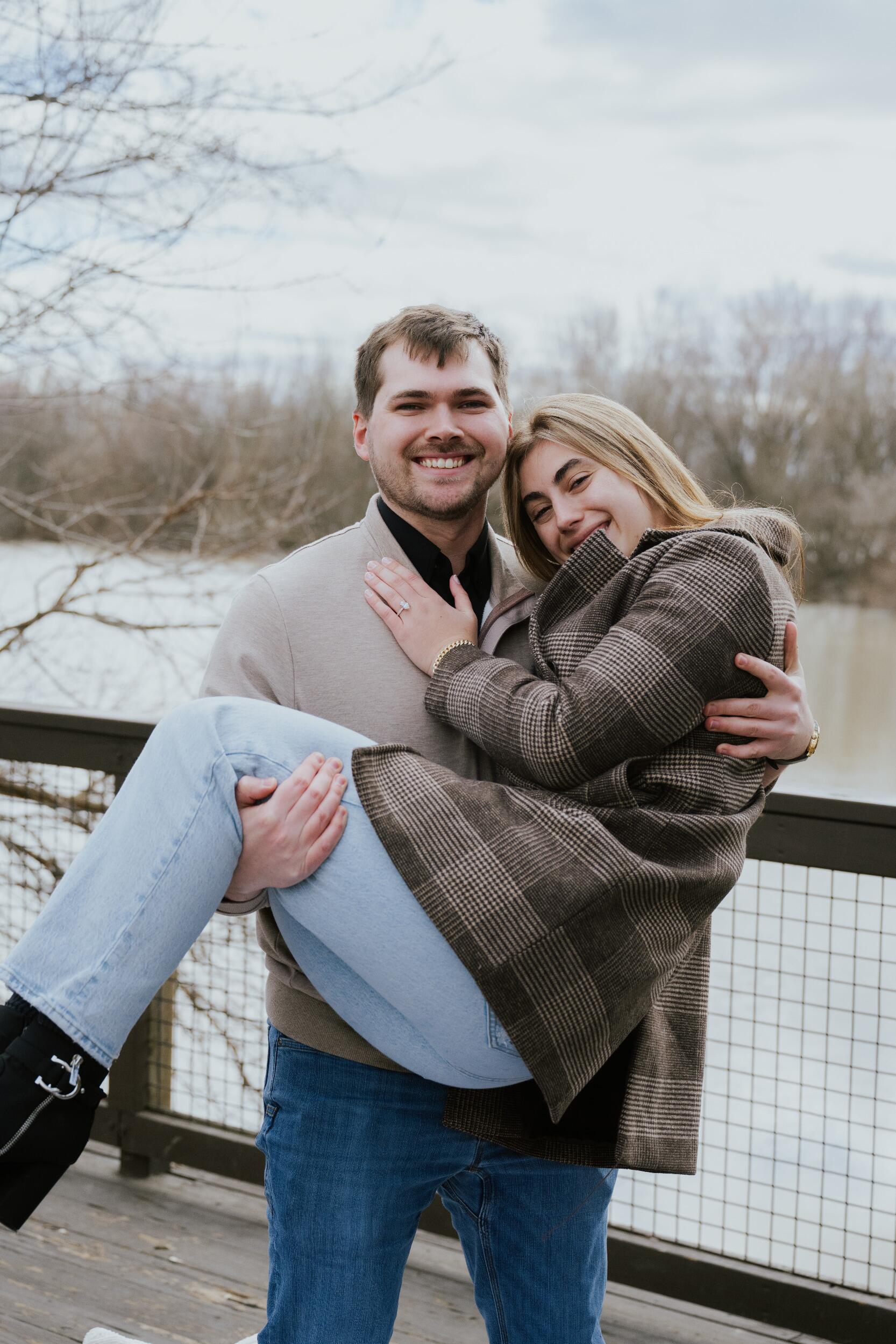 They walked around The Ohio State University and went to the location of their first date. Their sisters set up some pillow and blankets near Scioto Park where Nathan proposed. Their immediate families were waiting at their apartment to celebrate together afterwards. 