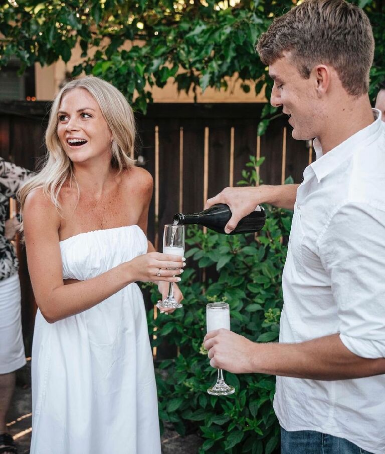 WE ARE ENGAGED! Such a special moment celebrating with friends and family at our home. 