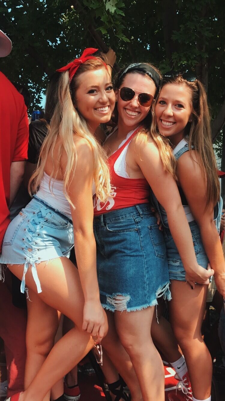 John walks up to Savannah and her friends at a Husker tailgate, introduces himself, compliments her outfit, and tells her, "Savannah is a beautiful name."