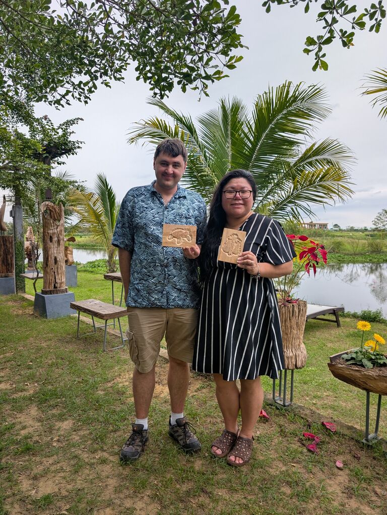 Trying our hand at wood carving in Hoi An, Vietnam