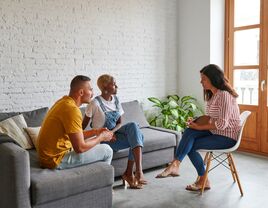 Couple with in a session with a counsellor