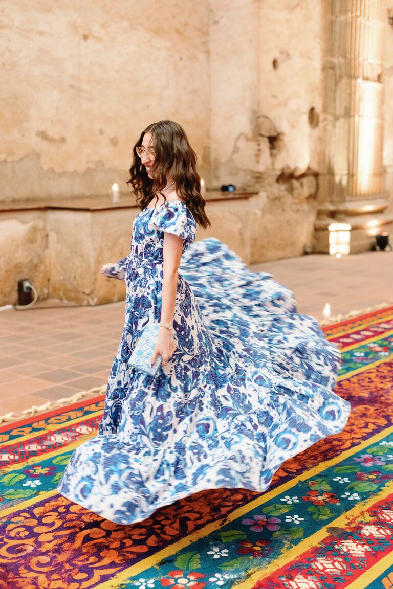 Influencer Caroline Vazzana dancing on sawdust carpet in Antigua, Guatemala