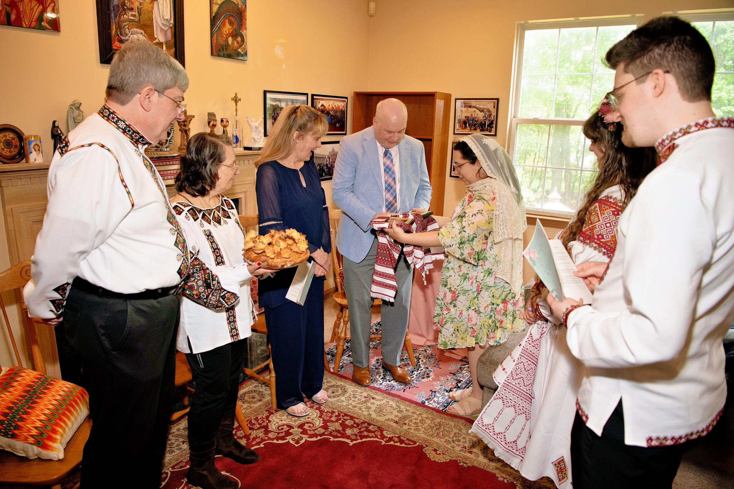 Then both sets of parents were invited to sit while Giana handed them the Korovai and the Icons