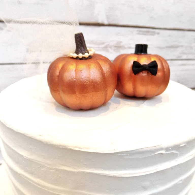 Comical Pumpkin Cake Toppers for a Spooky Wedding