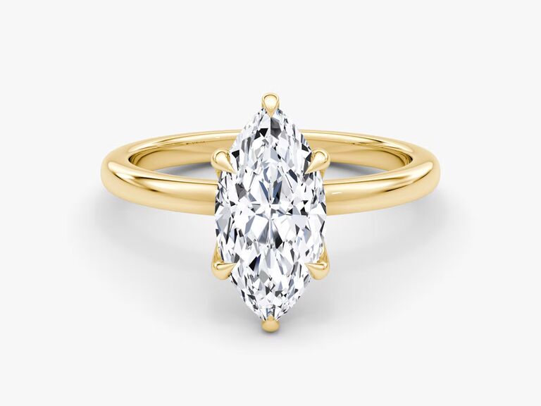 classic marquise-cut engagement ring with simple gold band