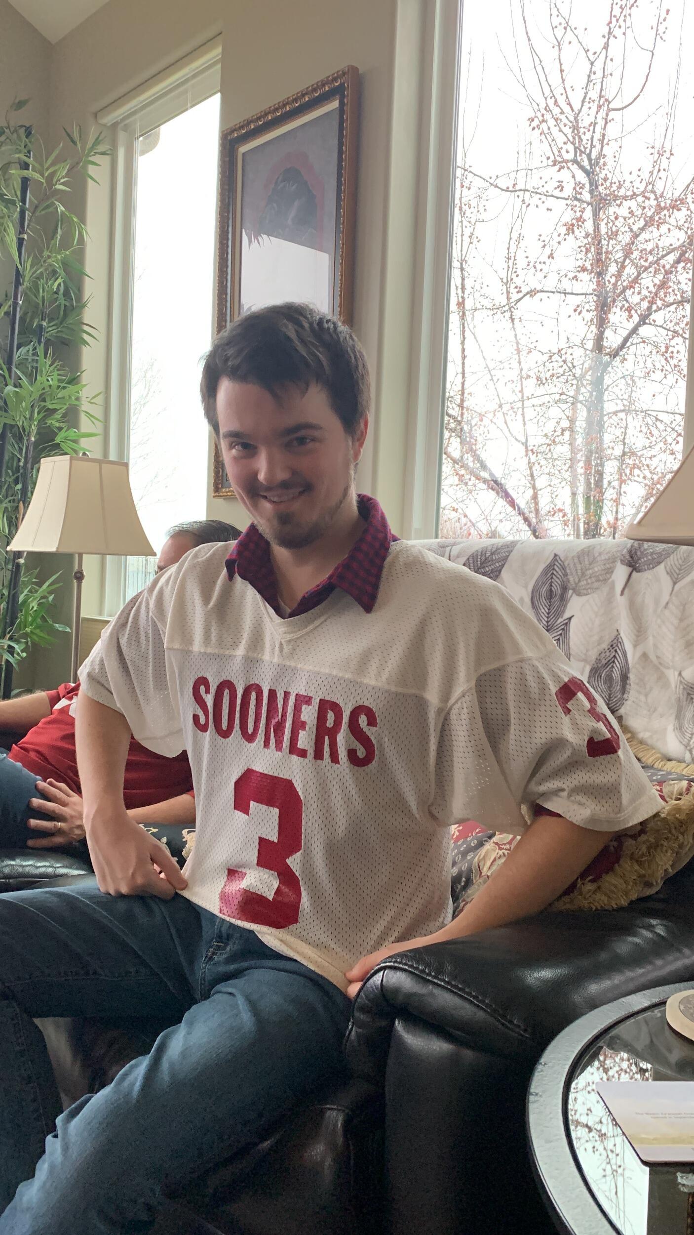 The next time we reunited was at Christmastime. My dad decided that if Sam was going to be part of the family, he absolutely had to have a Sooners jersey.