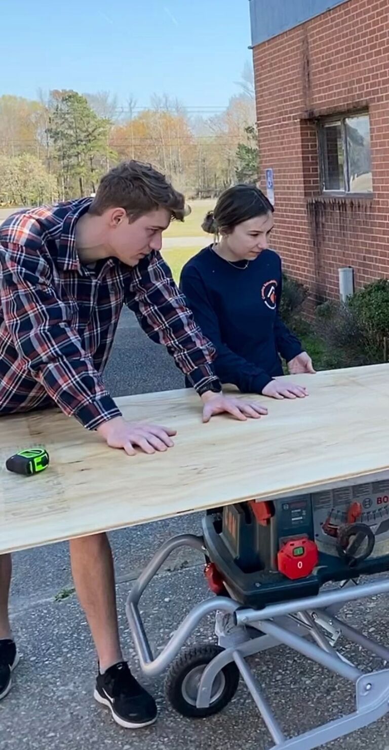 A monumental day: Jake taught Annika how to use a table saw and they quickly became a great team. 