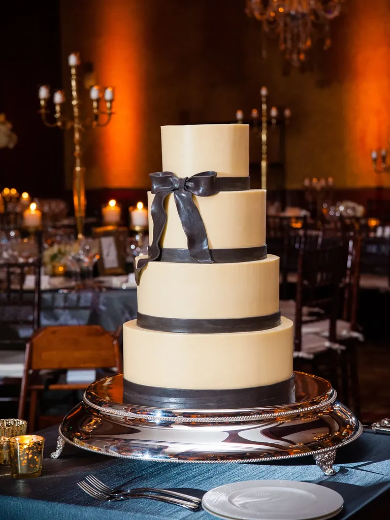 Dark academia wedding cake with black fondant bow
