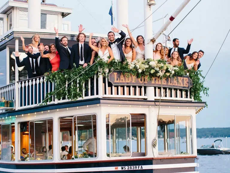 Bride and groom with wedding party sailing on Lady of the Lake boat with Lake Geneva Cruise Line