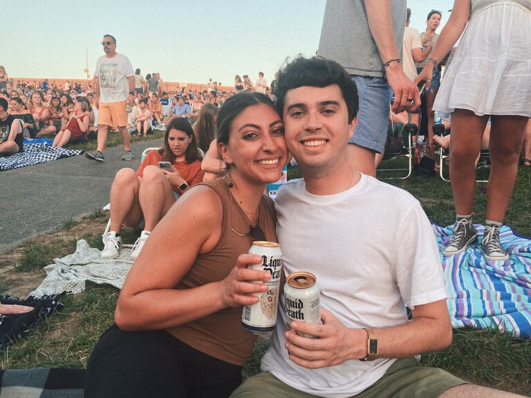 The couple checked off a bucket list item seeing The Lumineers together in concert! Don't let these smiles fool you, it was 100 degrees outside at the outdoor concert! 