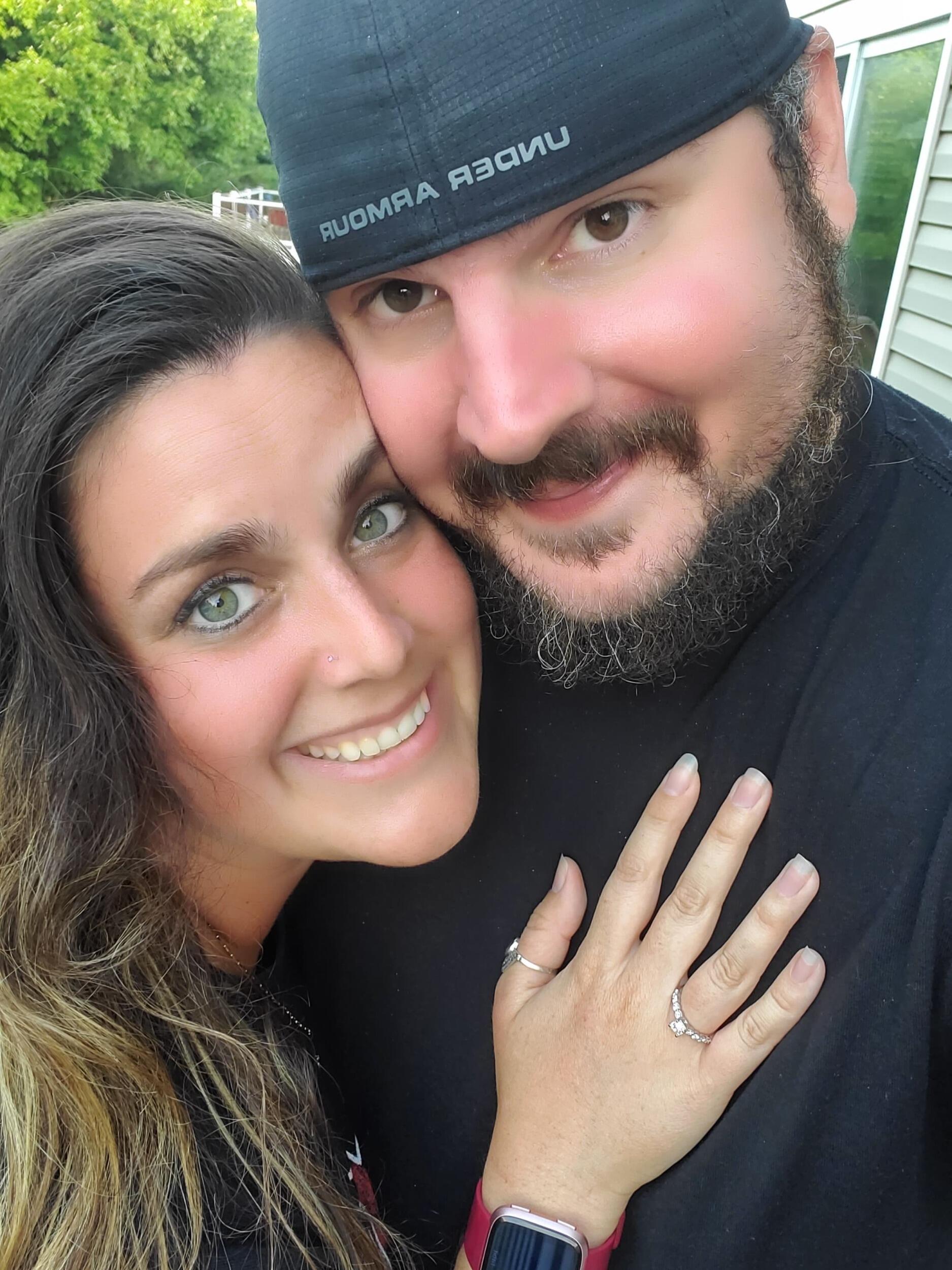Surrounded by family, sun kissed from an afternoon at the pool, and digging in to Mama's pizza at their home in Breinigsville, Cory got down on one knee.  A very shocked Kelsi replied, "YES" to Cory's question of "Will you spend the rest of your life with me?"