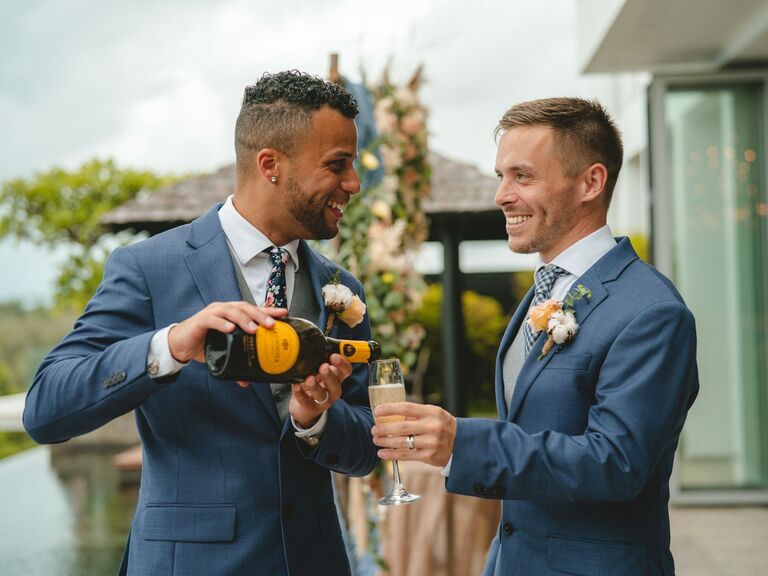 A couple celebrates their elopement with a champagne toast. 