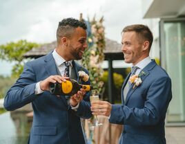 A couple celebrates their elopement with a champagne toast. 