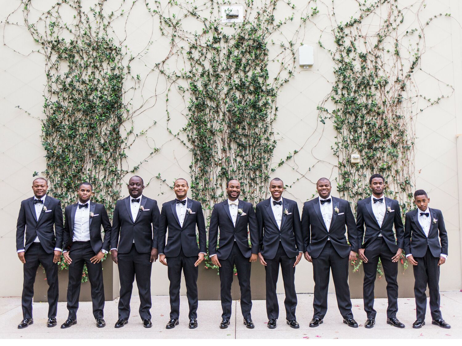 Junior groomsmen with groomsmen in wedding party.