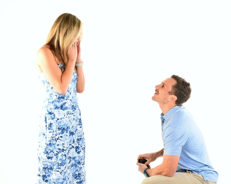 11 months after their first cruise Jason proposes at the PERFECT spot ... the photo booth outside of the main dining room. 