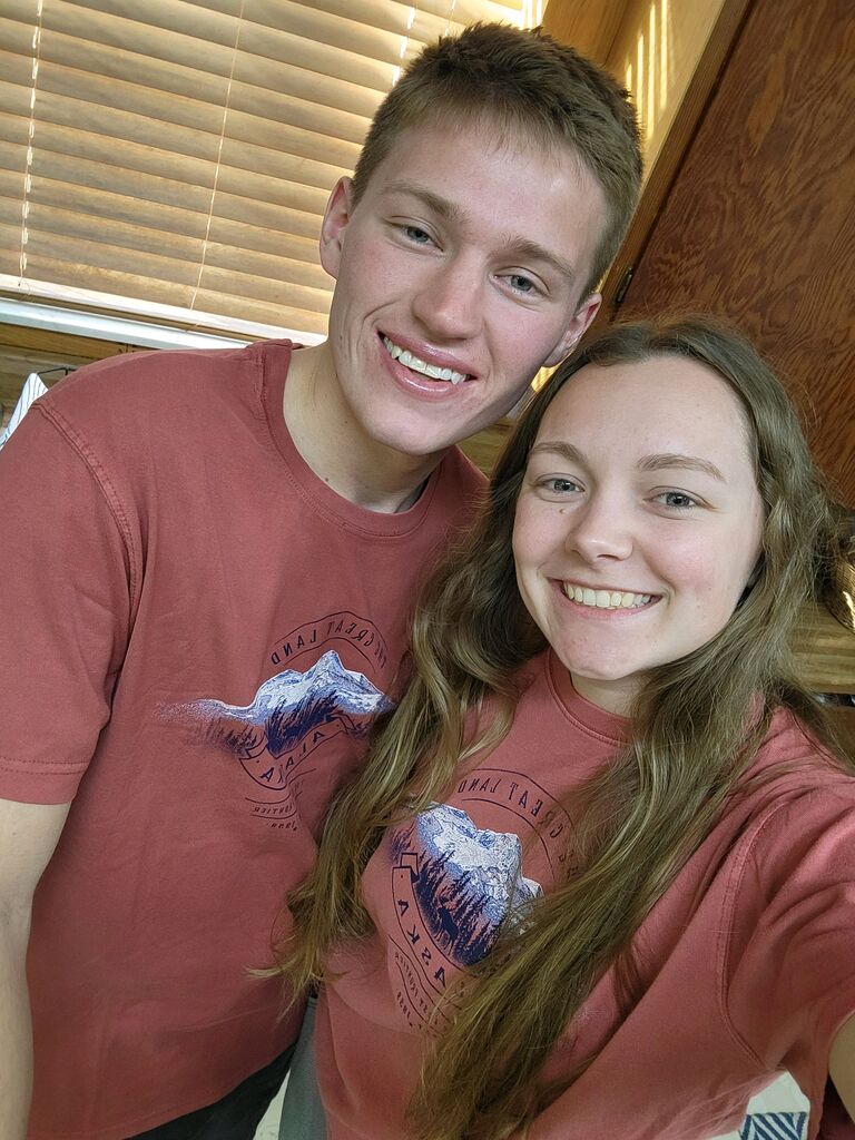 Rachael bought Zach a matching shirt from her trip to Alaska!