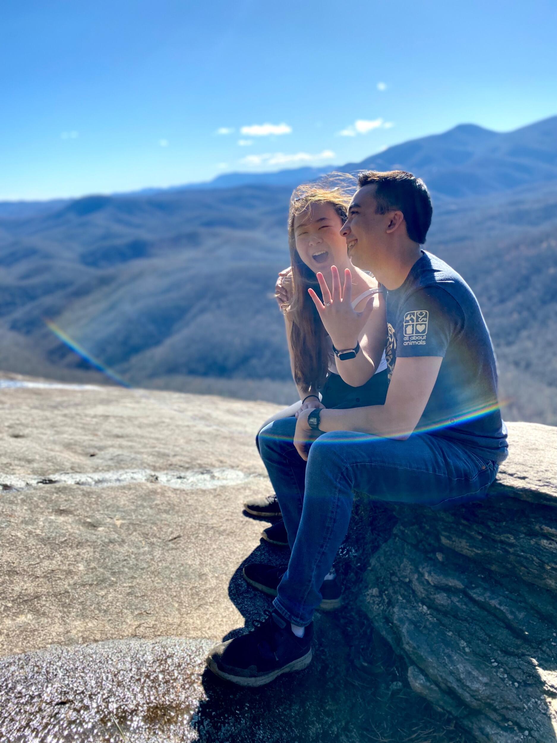 Garrett is thrilled to be engaged to me, especially after I made him hike 8 miles up and down this mountain in Asheville.