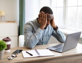 Man stressed from working too much.