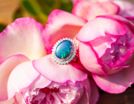Opal engagement ring sitting on flowers