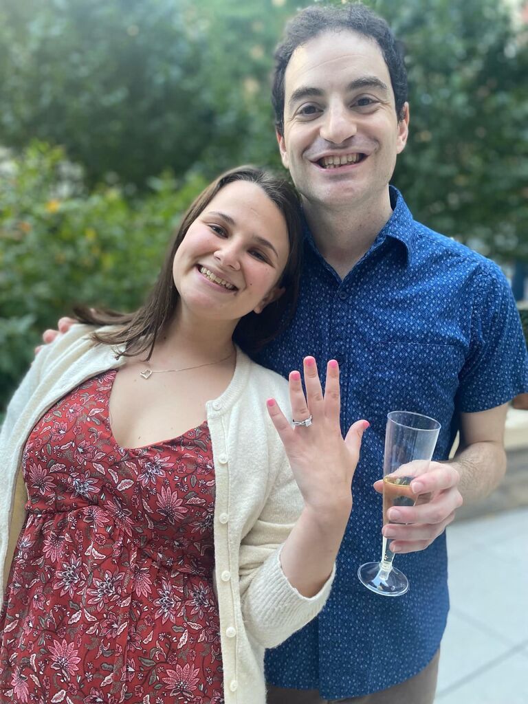 Knowing it was the ONLY way he could actually surprise Elyssa; David spent the whole day decorating the apartment for an elaborate and one-of-a-kind apartment proposal. Following the proposal David had arranged a courtyard of friends and dinner with Elyssa's parents! (Elyssa said yes, btw!).