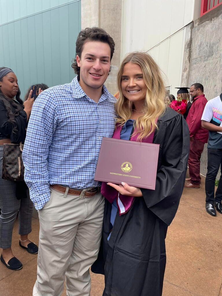 Graduated with my BBA from MSU! Had our family for the support! No clue I would be a fiance in 5 days!