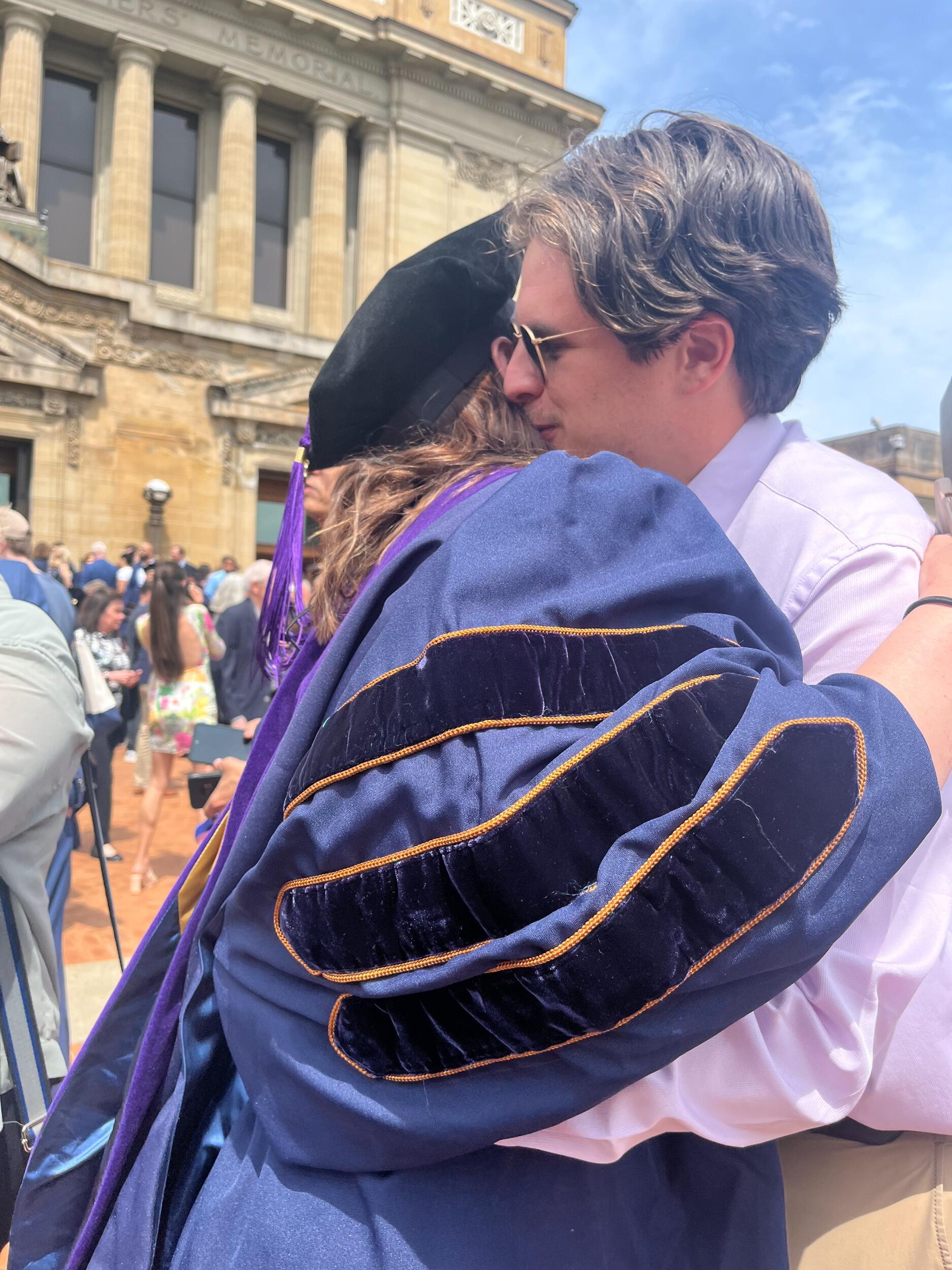 Once again supportive boyfriend Fritz arrives at Katy's law school graduation. 