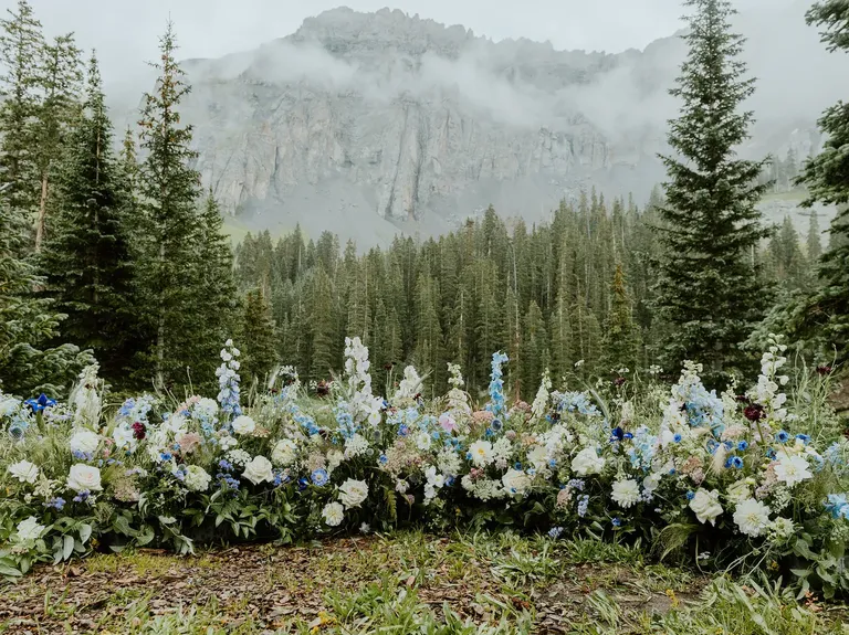 Wildflower floral arrangement for outdoor wedding ceremony, taylor swift themed wedding