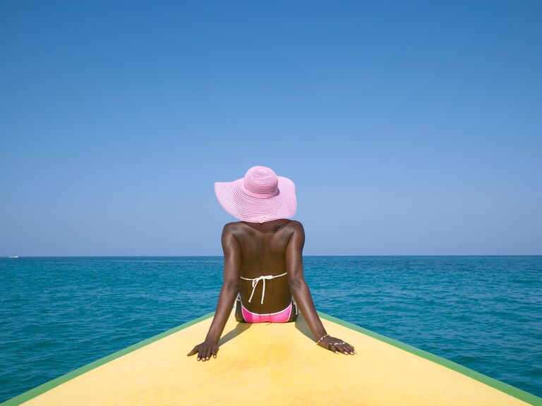 a person sitting by the ocean in jamaica