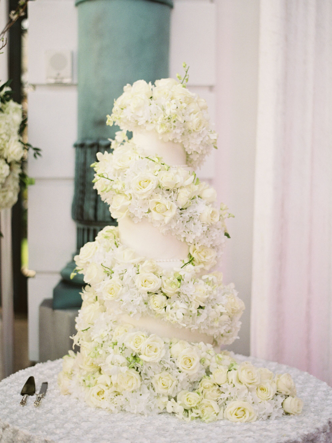 Cake with cascade of white fresh flowers