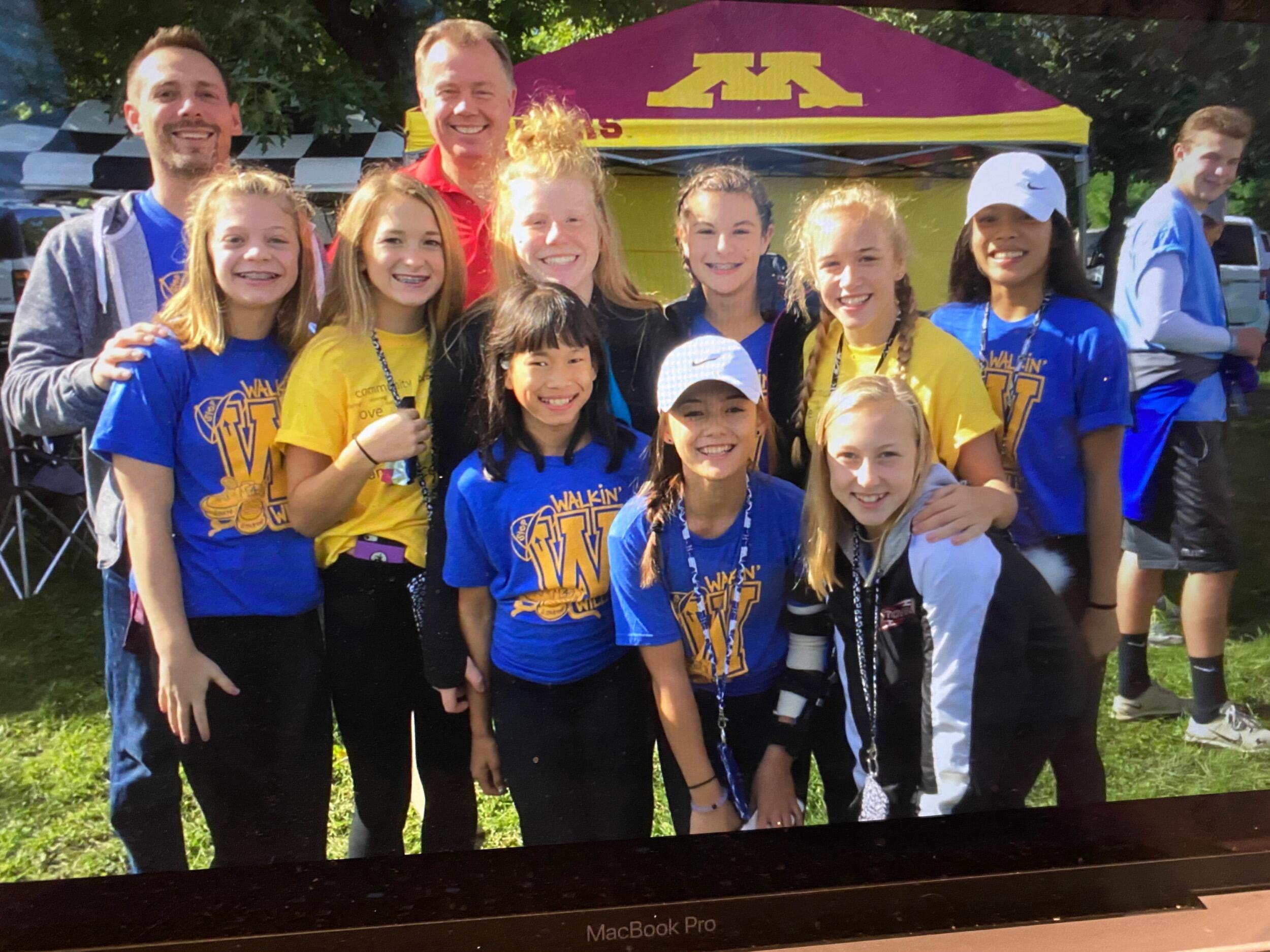Teague photobombed Brooke’s gymnastics team while at a Down Syndrome Awareness Walk with no idea of who she was.