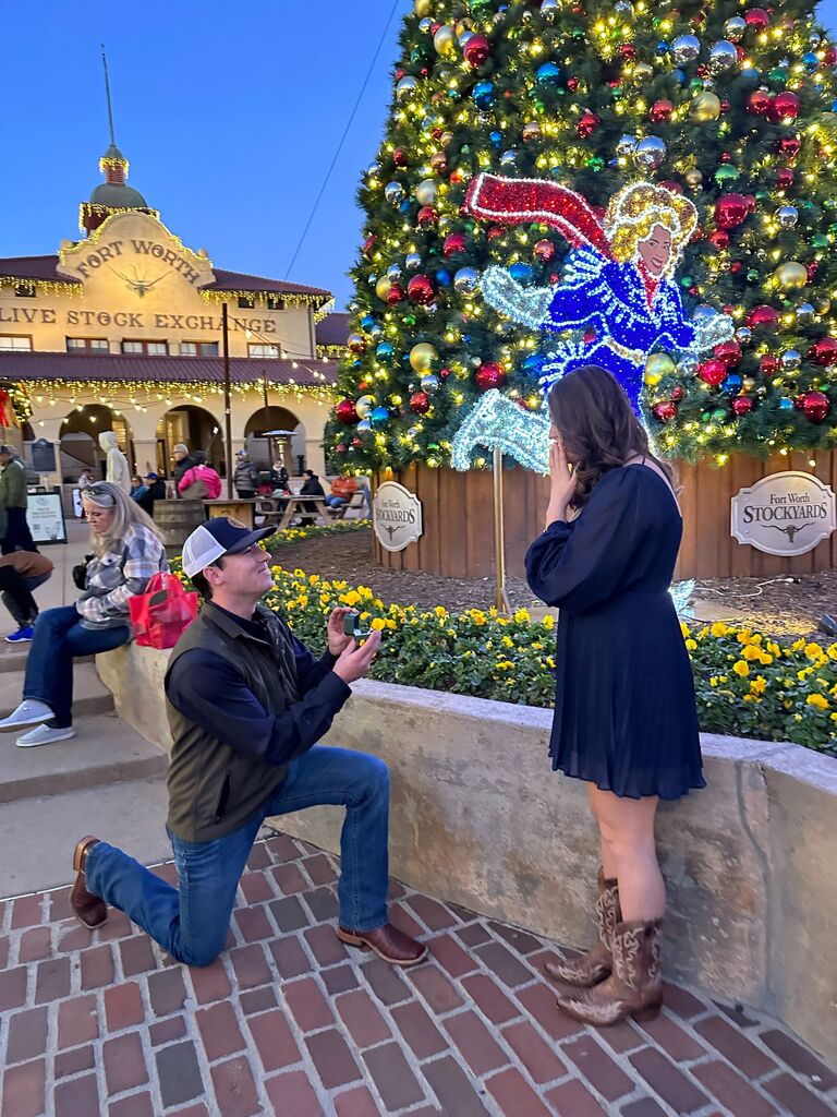 Proposal in front of the Christmas tree in the Fort Worth Stockyards