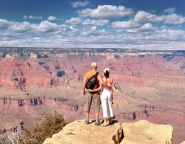 Couple looking out towards the grand canyon