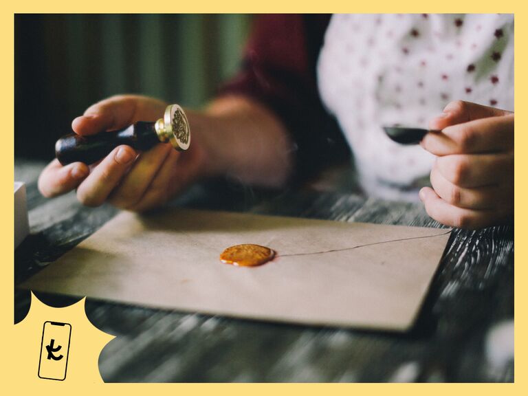 Woman decorating wedding invitations