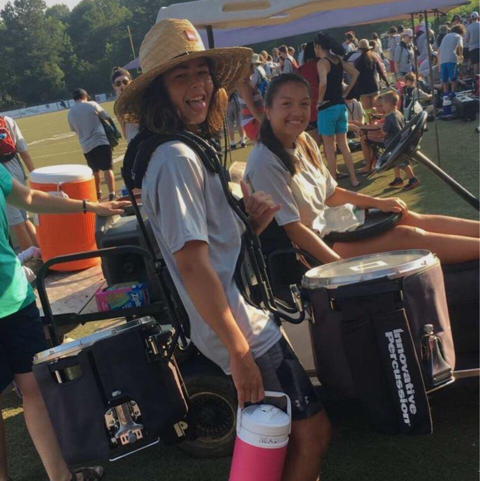 When Sarah twisted her ankle during band camp, so Dylan carried her drum around.
