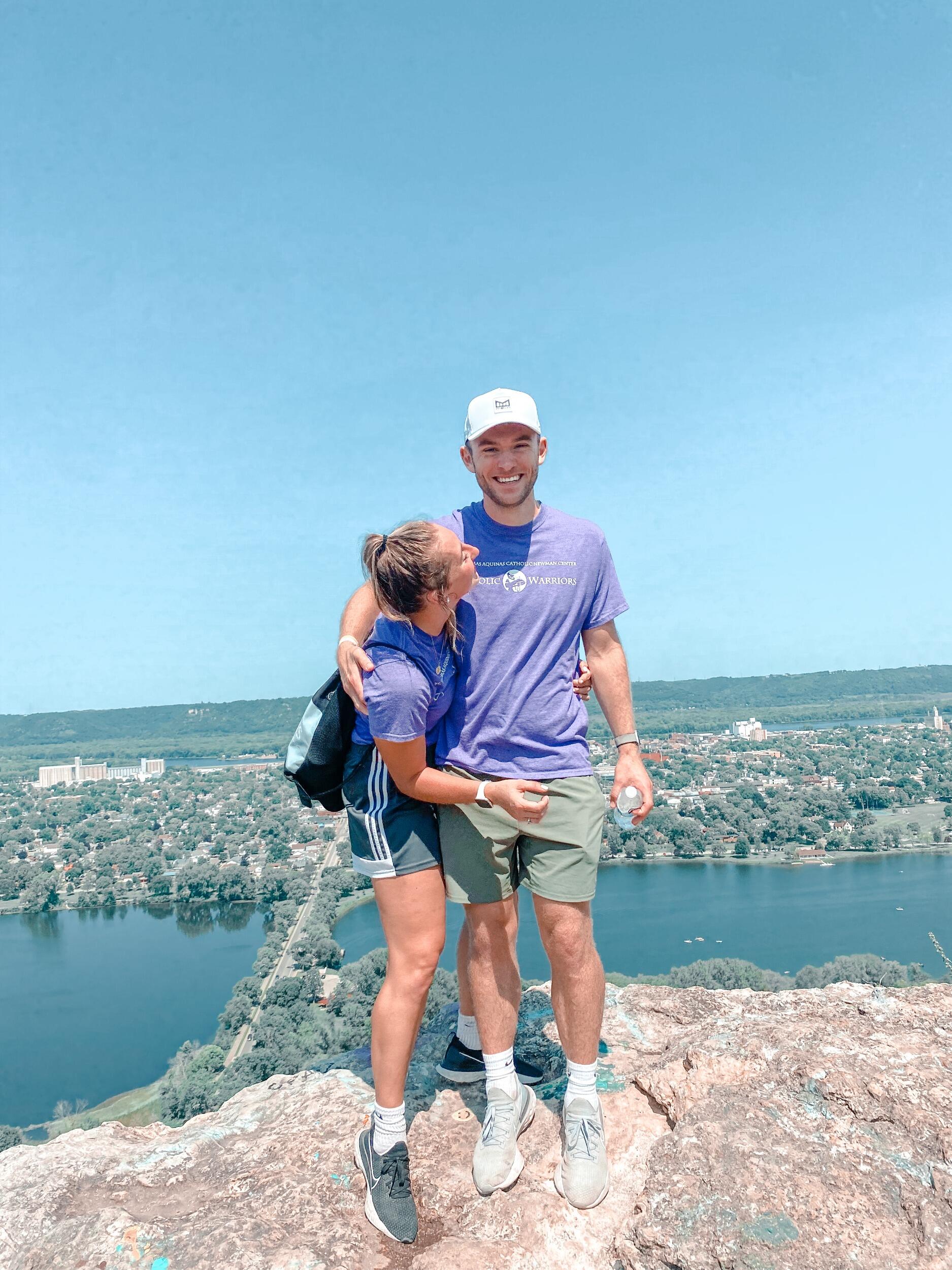 Our story begins in Winona, Minnesota. Sammy had just moved here from Oshkosh, Wisconsin, as he started his first year as a FOCUS Missionary. He came to Winona expecting a bigger city, not really taking a liking to this small town, but ready to begin his first year and new life as a missionary, which required him to “fast” from dating for a year. Evelyn had just moved back to start her junior year of college and she remembers meeting Sammy their very first day doing campus outreach. Sammy however remembers her catching his eye earlier that summer on a zoom call.