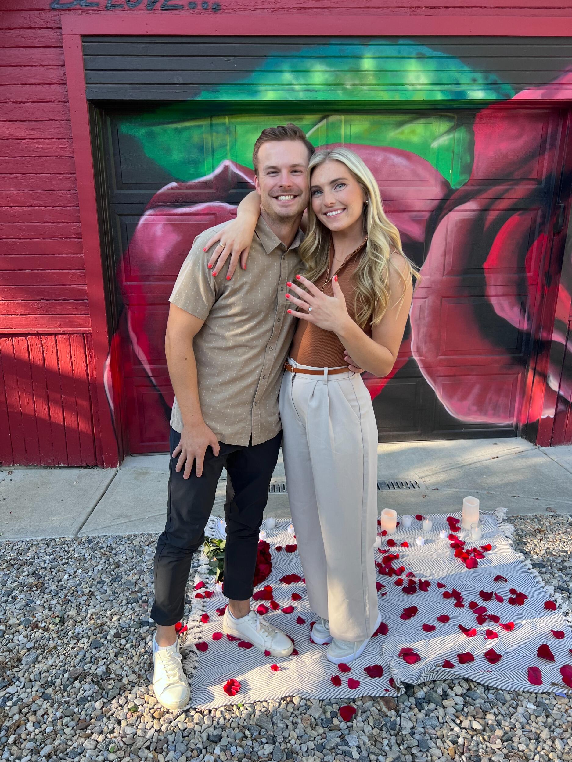 On September 15th, 2023, Patrick asked Annie to marry him. He told her that he made dinner reservations at Ambrosia on Friday night and that he wanted to walk around Broad Ripple before dinner. On their walk, he led her to Flower Alley. When they arrived, Pat got down on one knee and popped the question. Little did Annie know that Pat had recruited both of their sisters, Courtney and Olivia, to help plan the cutest proposal of all time. After Annie said yes, they all celebrated with champagne, some pictures and lots of happy tears. After their dinner reservation, Pat took Annie back home and surprised her with a house FULL of their closest friends and family. It was such an incredible night and special way to start their forever together. They are looking forward to an even bigger party at their wedding!