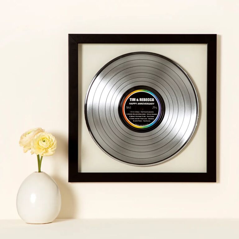 Custom metallic record displayed on a wall. 