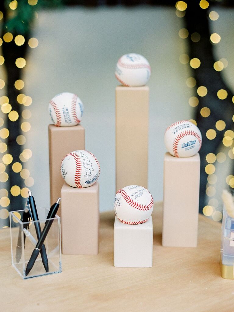 Baseballs on wood pedestals as guest book