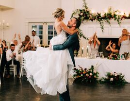 Couple having fun dancing at their reception