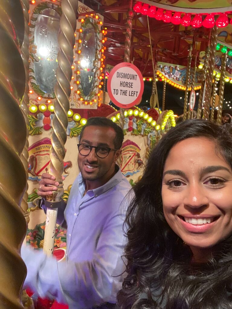 @South Bank Carousel.
Vijesh's first time on one! Anjali eagerly obliged.