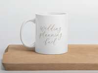 'Wedding planning fuel' in elegant light gray script on white mug