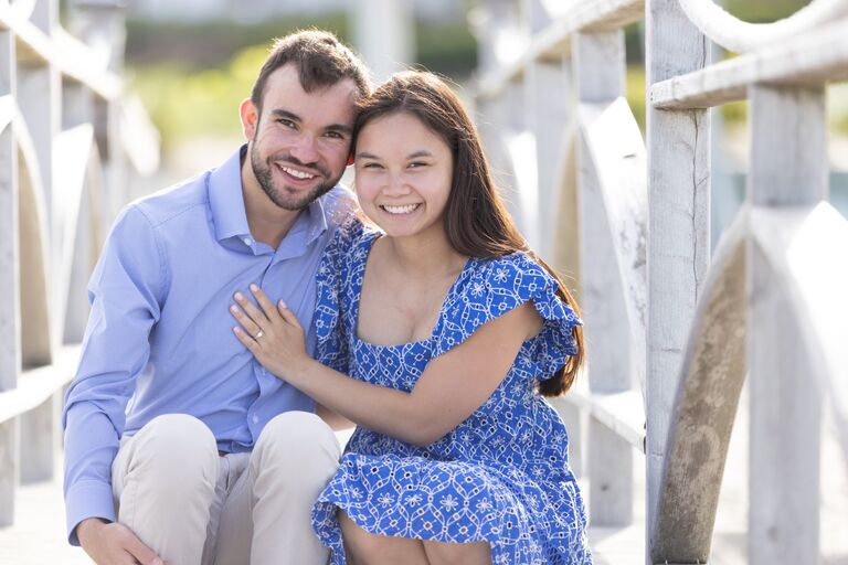 Chris surprised Emily with a trip to the Chatham Bars Inn. They enjoyed the breakfast buffets, delicious dinners, and Lexus chauffeurs. Chris brought Emily down to the beach that was perfectly set up with chairs, a blanket, roses, and champagne. They walked down the beach where Chris proposed. Emily said yes and they look forward to the next chapter together!!